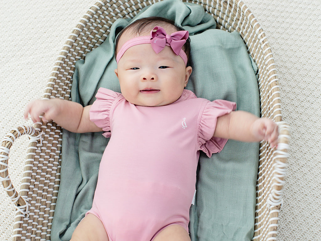 Adorable Elegance Unveiled: The Premium Bamboo Frill Sleeve Onesie for Your Baby Girl