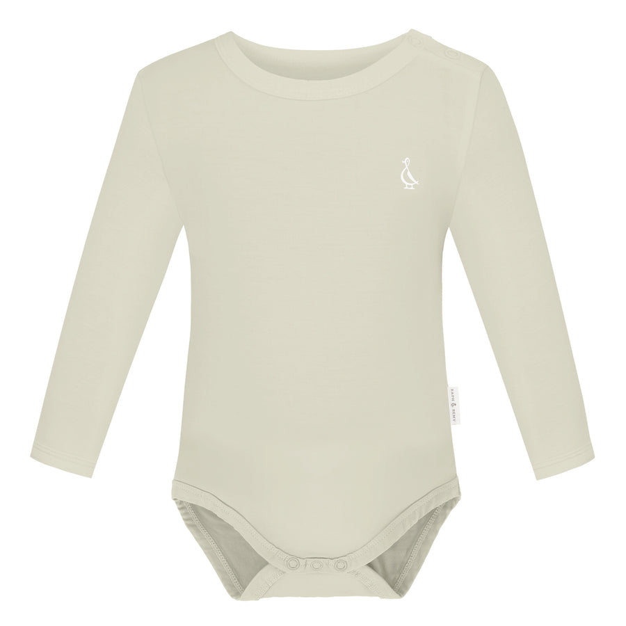 Soft Bamboo Long Sleeve Baby Onesie in beige.
