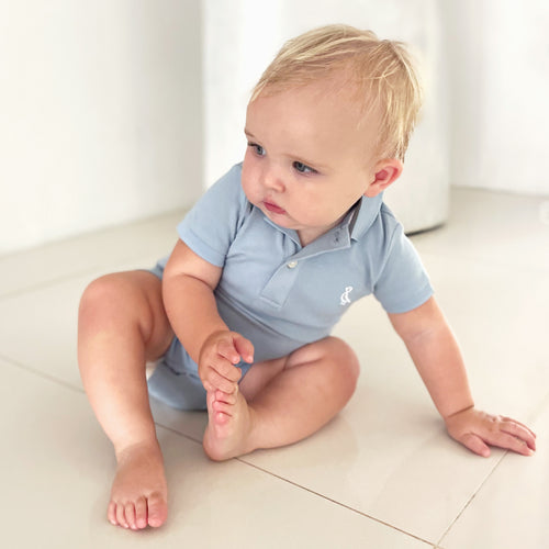Sustainable and breathable baby romper with classic detailing