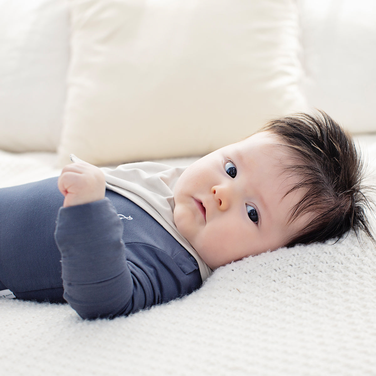 Neutral bamboo baby bib with minimalist design