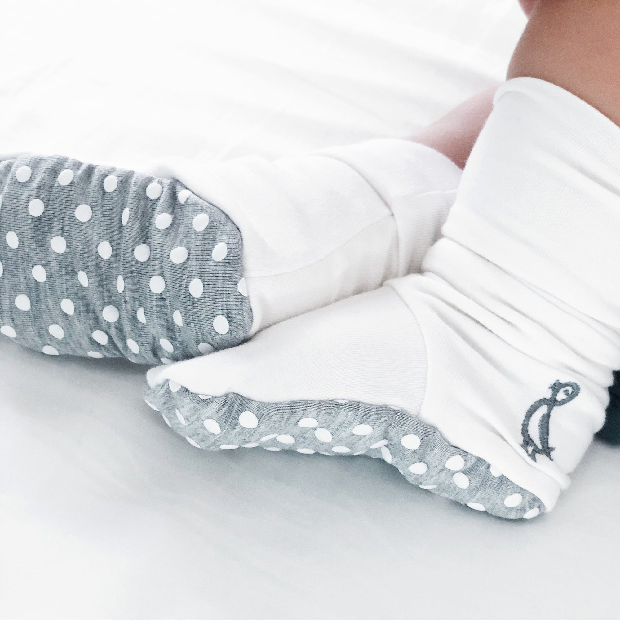 Infant wearing bamboo baby shoes gentle non-slip booties for newborn comfort
