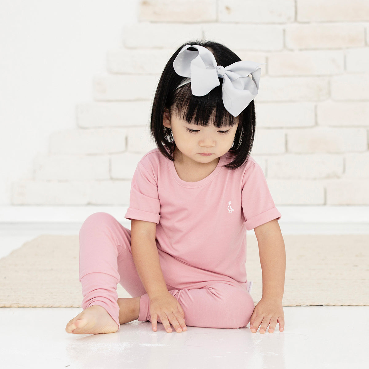 Stylish dusty pink bamboo baby t-shirt with a timeless design 