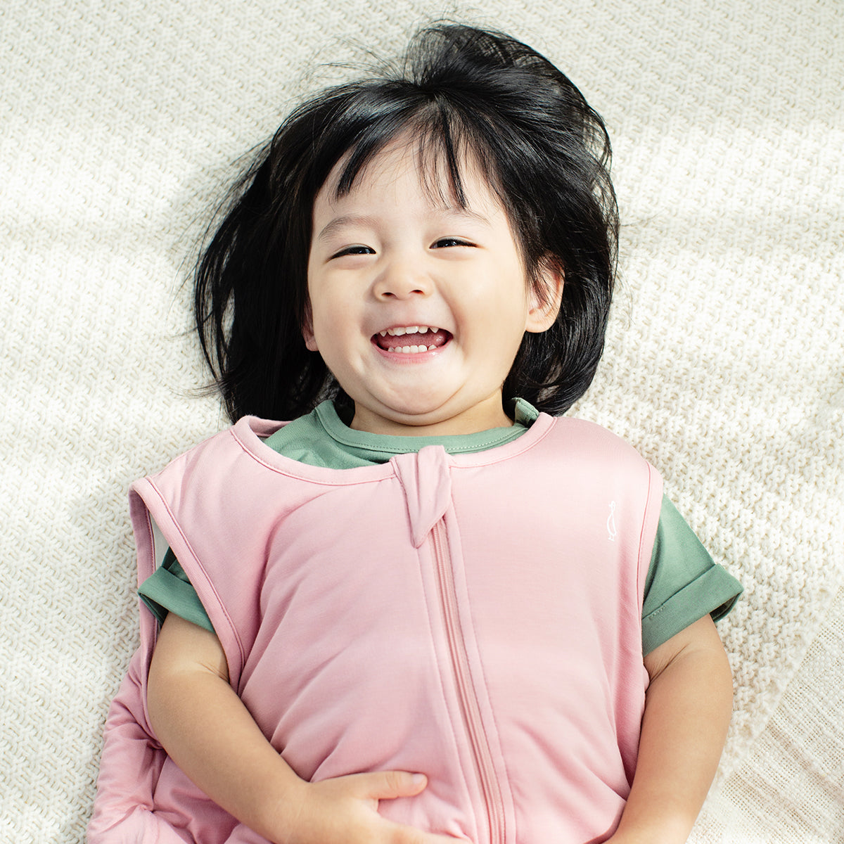 Happy baby wearing RAPH&REMY® sustainable bamboo baby t-shirt 