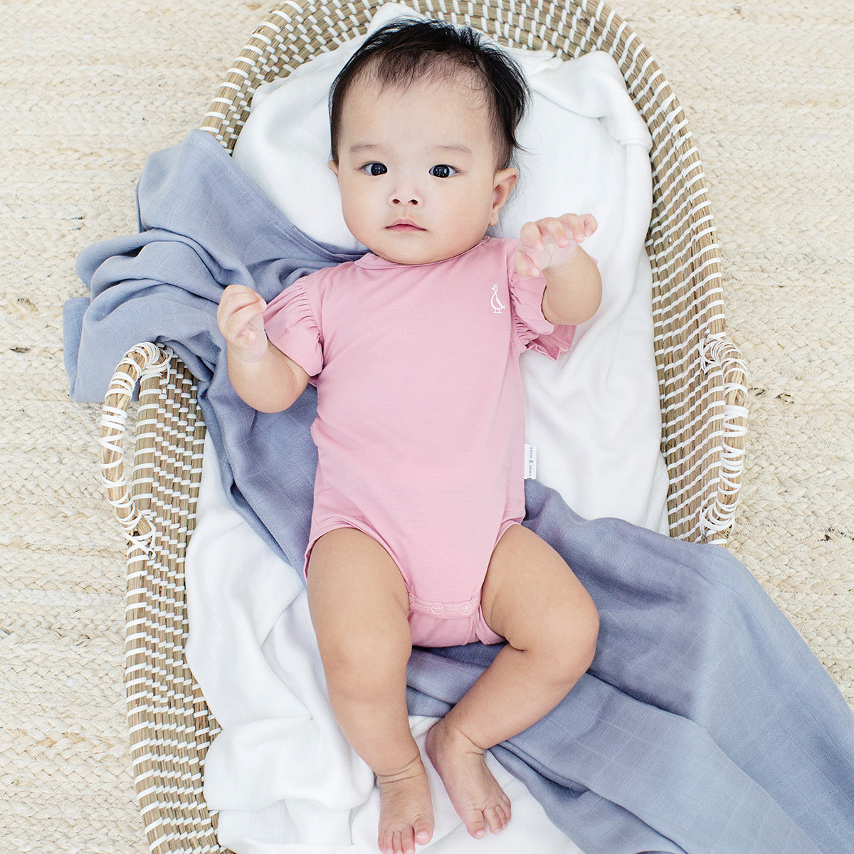 Cozy baby bamboo swaddle with simple pattern, ideal for keeping infants snug.