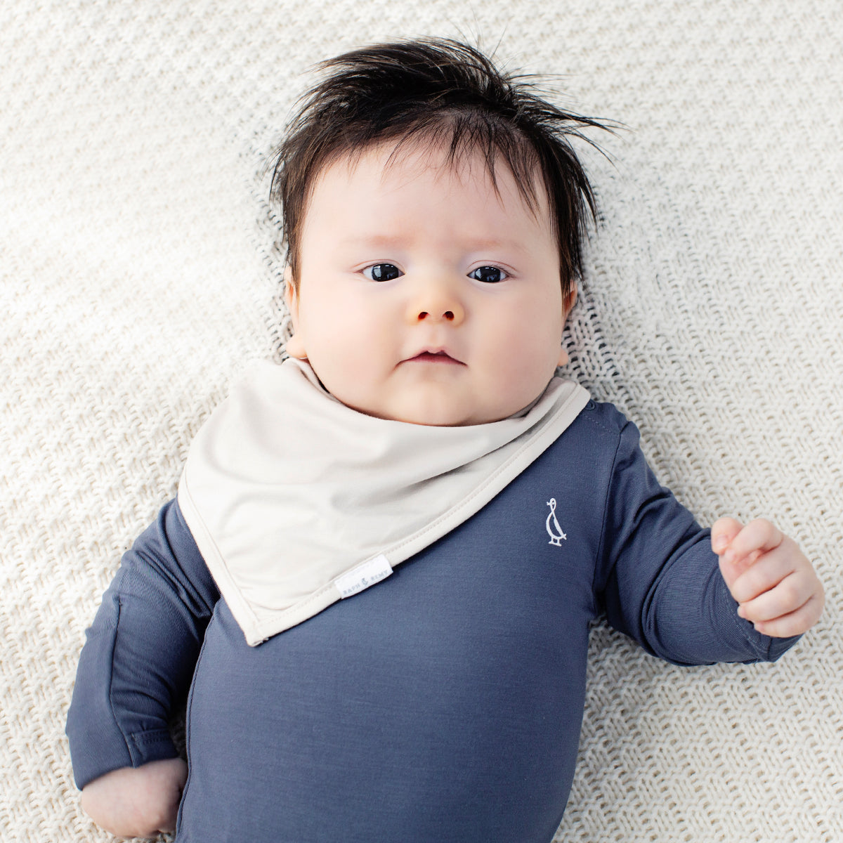 Baby snuggled in Bamboo Long Sleeve Baby Onesie by RAPH&REMY®