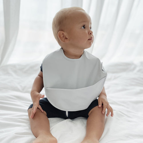 Premium Waterproof Feeding Bib with food-resistant material by RAPH&REMY® in pastel color