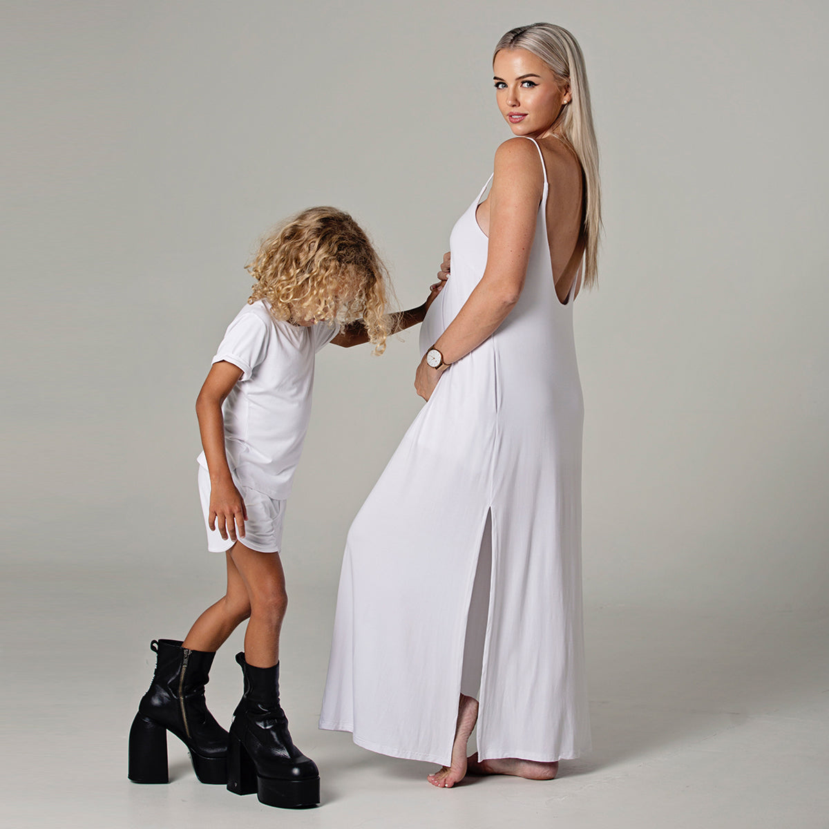 Side view of Ari flowy cami maxi dress in white