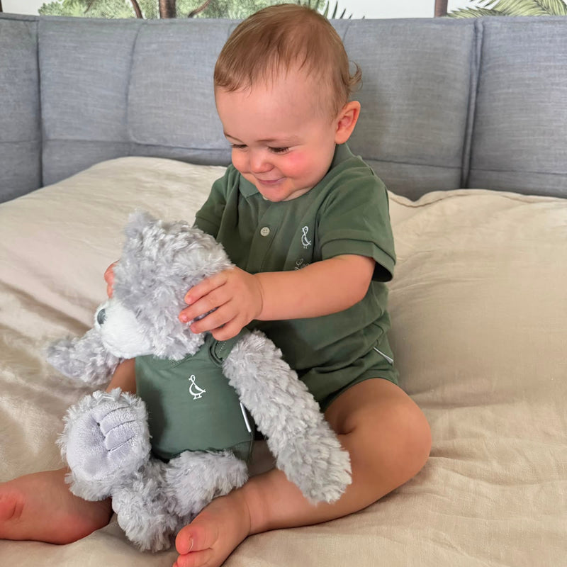 One year old in the RAPH&REMY army green Collared Romper, the birthday outfit from the 1st Birthday Box