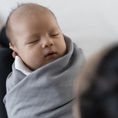 Breathable baby swaddle featuring a soft bamboo material in elegant grey color by RAPH&REMY®