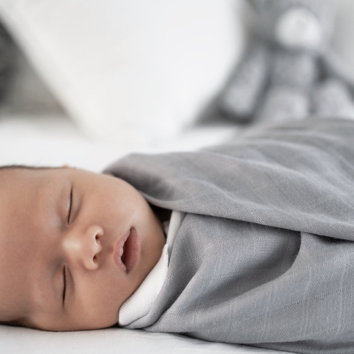 Lightweight bamboo swaddle for babies in a calming pastel color, perfect for swaddling newborns.