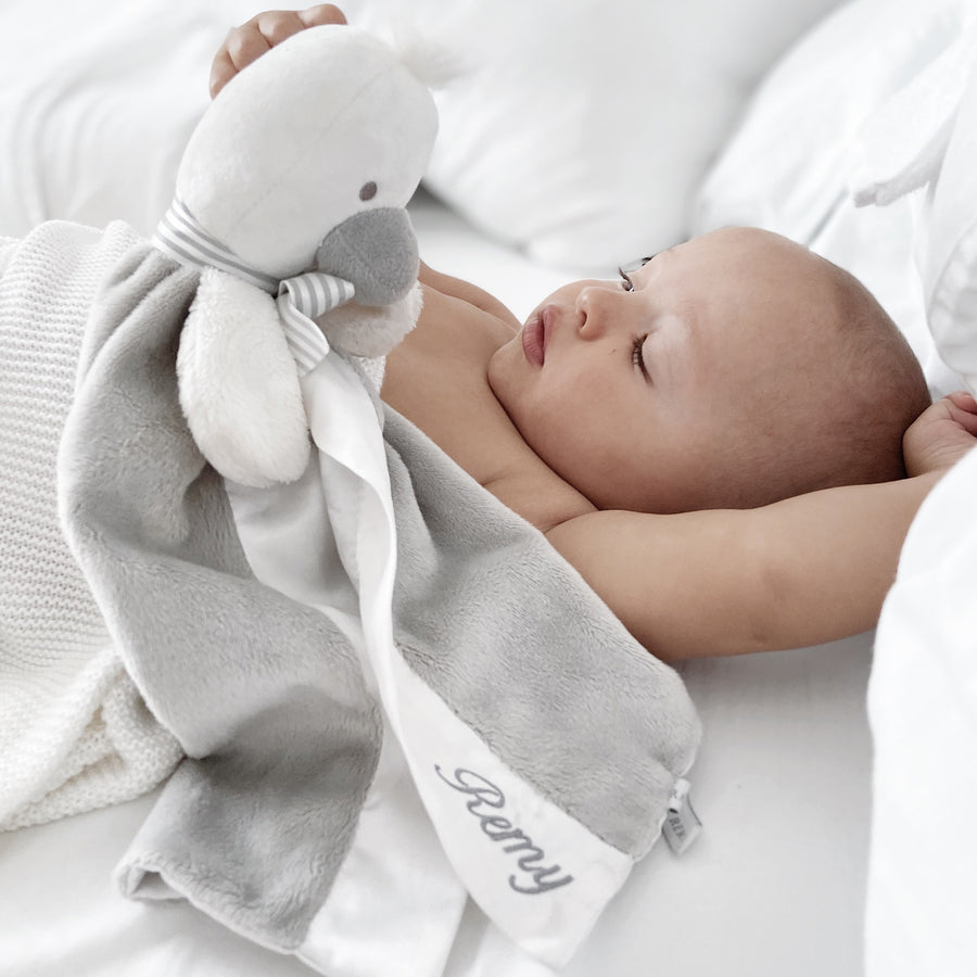Baby cuddling SootherBuddy™ Security Blanket in soft bamboo fabric