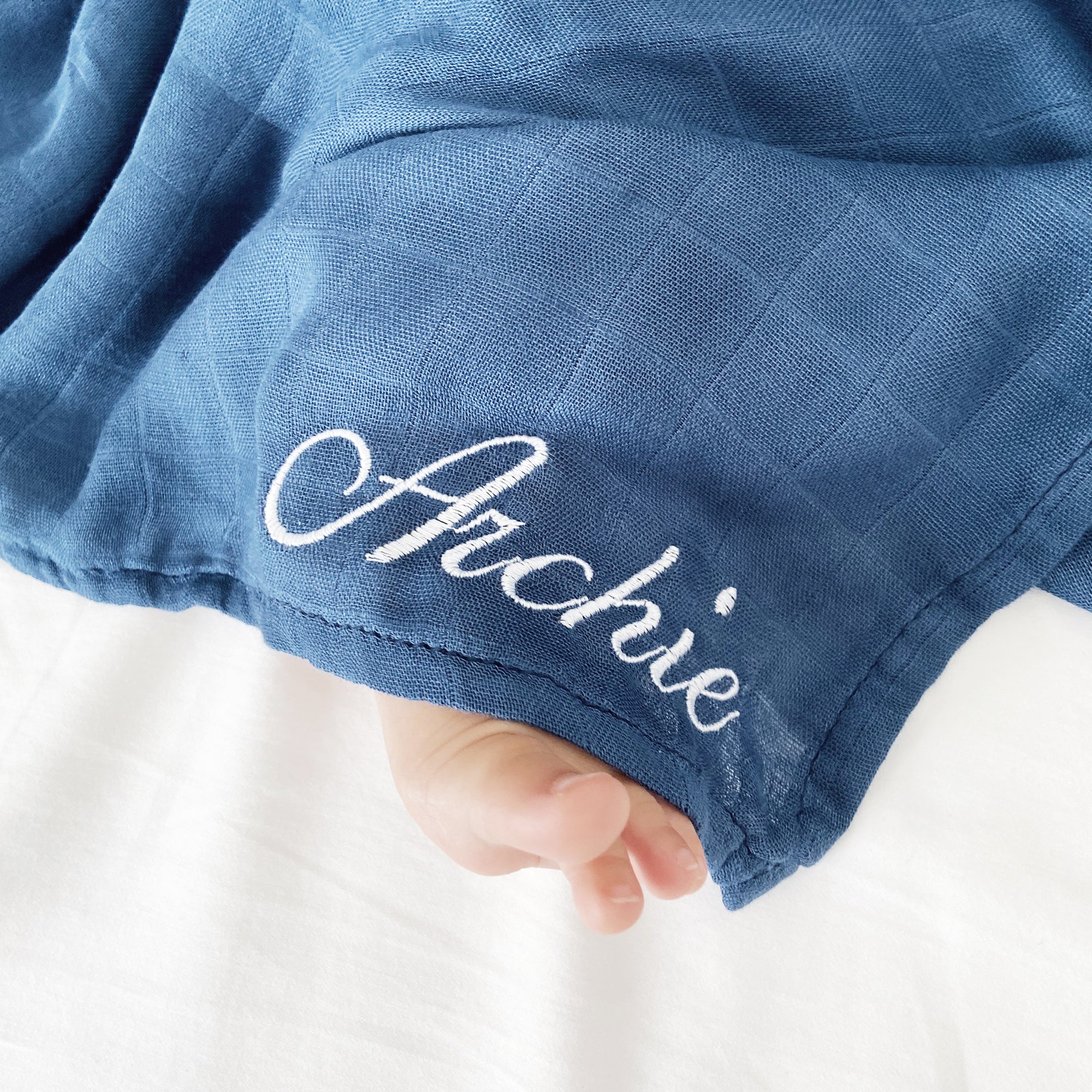 Customizable blue bamboo swaddle by RAPH&REMY® featuring a unique design tailored to your preferences. 
