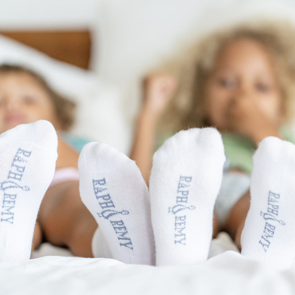 Child playing indoors wearing bamboo kids socks anti slip design