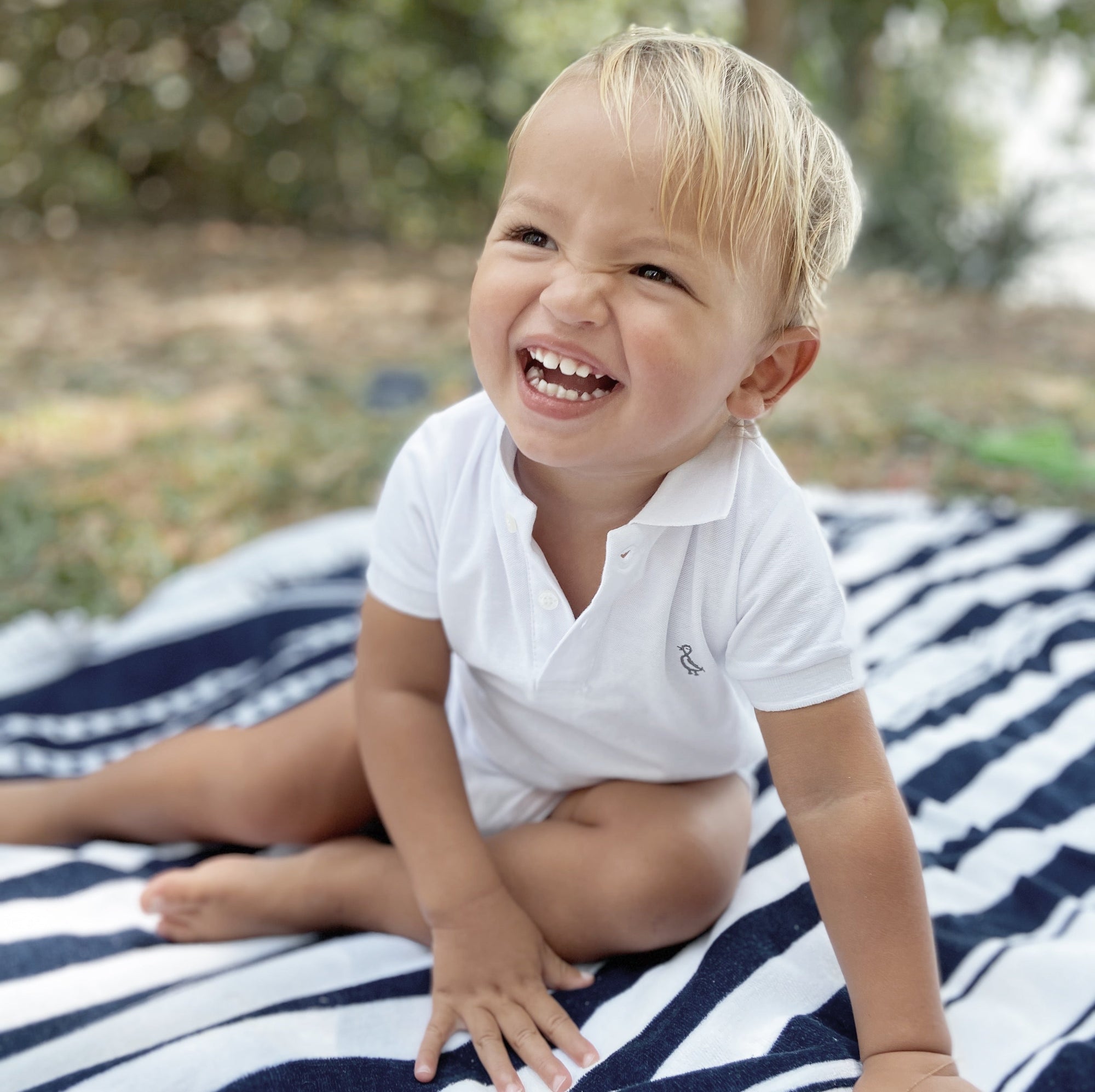 Easy-to-wear bamboo romper in white with front button closure