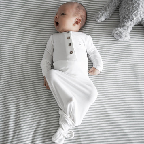 Cozy newborn wrapped in RAPH&REMY® bamboo sleep gown